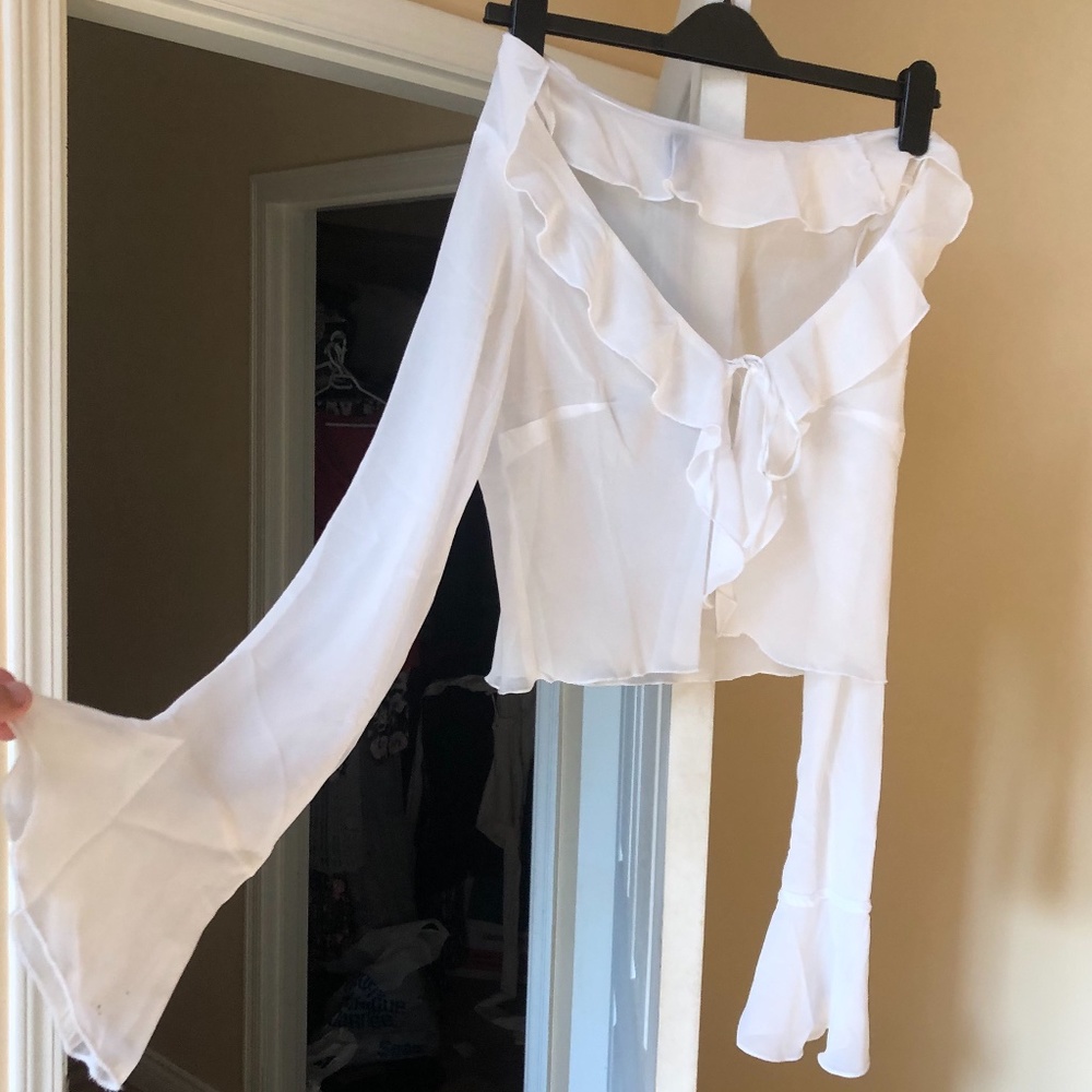 White ruffled blouse